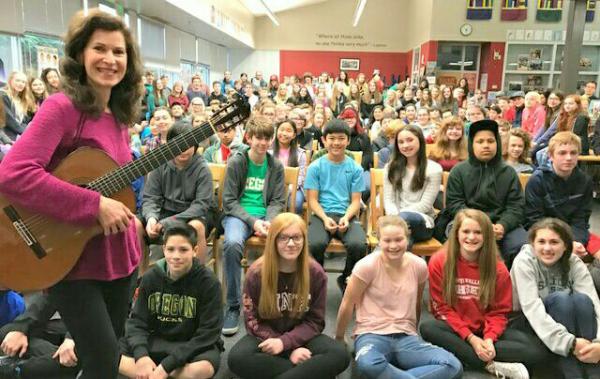 Classical guitarist Sharon Isbin plays for schoolchildren in Eugene, Oregon. Photo courtesy of Sharon Isbin 