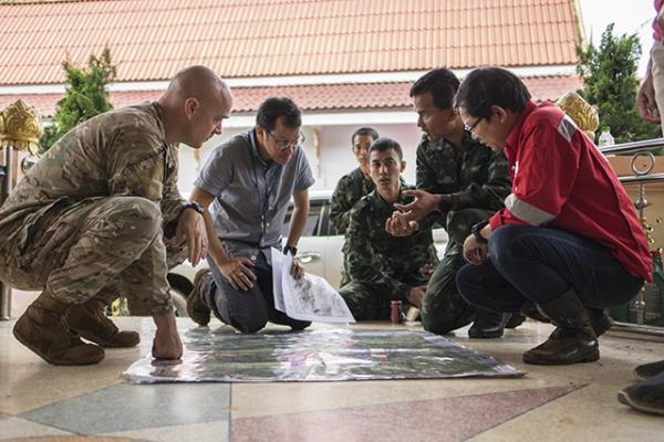 Airmen from the U.S. Indo-Pacific Command meet with Thai military officials and a Thai engineering company in Chiang Rai, Thailand, to advise and assist in the operation to rescue members of a soccer team and their coach.