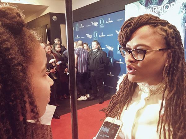 ￼ Adedayo talks with director Ava DuVernay at a screening of A Wrinkle in Time in New York City.