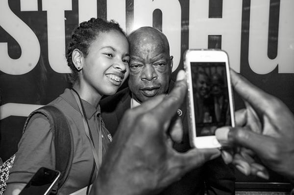 Adedayo earlier this year with Representative John Lewis, a civil rights leader and Democratic Congressman from Georgia