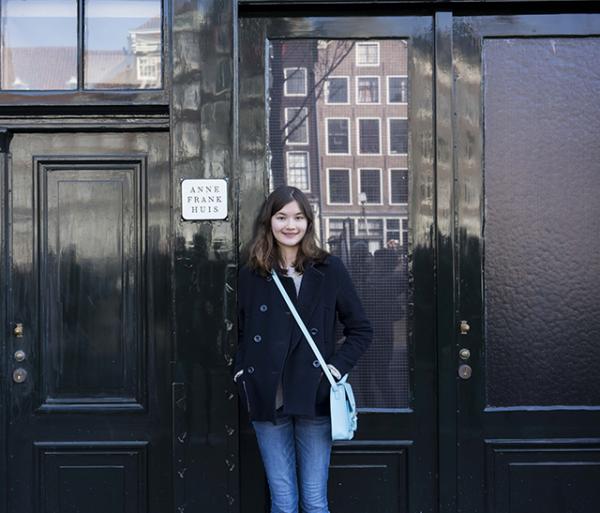 Charlotte stands outside the house in which Anne Frank hid. It’s located in the back of her father’s office building, in the heart of Amsterdam. Charlotte stands outside the house in which Anne Frank hid. It’s located in the back of her father’s office building, in the heart of Amsterdam.