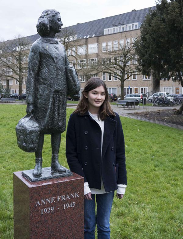 Charlotte next to a statue across the street from Anne’s apartment.