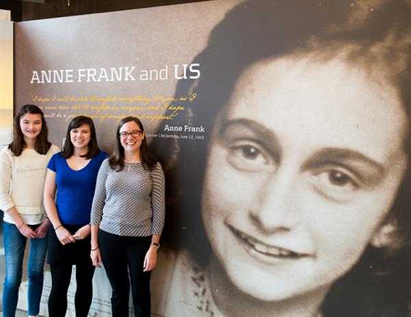 Charlotte (left) with Hannah Vaughn (center) and Beth Slepian near the entrance of the Anne Frank Center USA in New York City