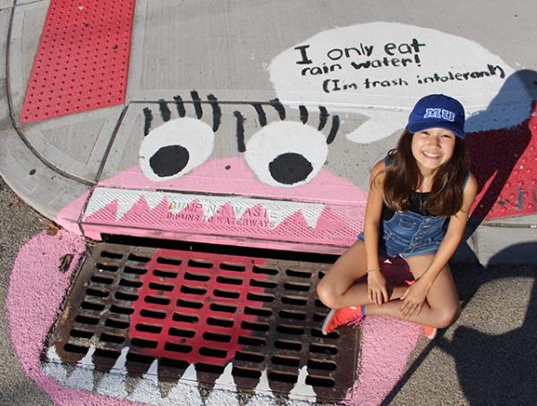 Ava Park-Matt painted this drain mural in Hoboken, NJ with her Girl Scout troop.	  