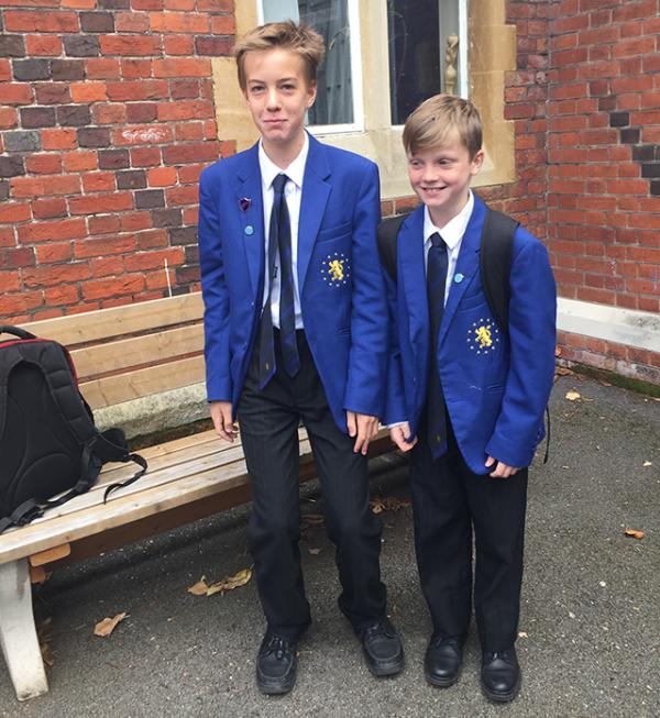 Benedek (left) and a classmate in uniform at the Hockerill Anglo-European College in the United Kingdom