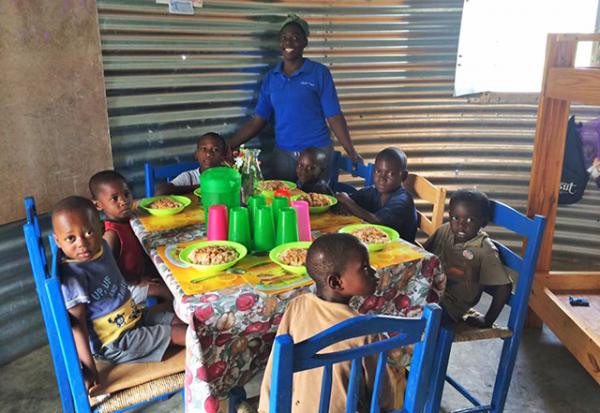 A family eating a meal in a Safe T Home. Photo by Sukup Manufacturing