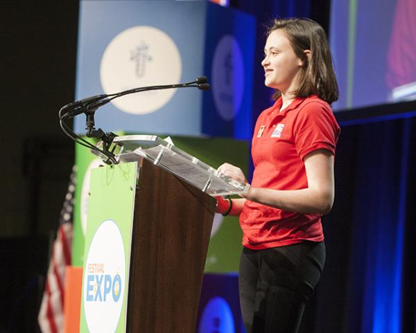 Courtney at the podium for the STEM Education stamps dedication ceremony