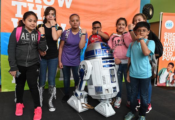 Chicago area students displaying their Kid Power Bands with R2-D2 Students from the Chicago area display their Kid Power Bands with R2-D2 Chicago area students displaying their Kid Power Bands with R2-D2 Students from the Chicago area display their Kid Power Bands with R2-D2