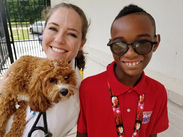 Dr. Catherine Foret and Grits the dog