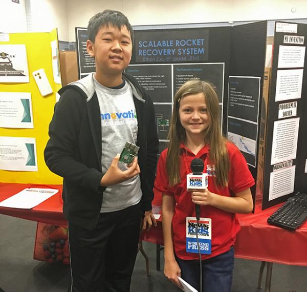 Kid reporter Annika Petras with 8th  grader, Ethan Zou, Jeffrey Trail Middle School, creator of the Scalable Rocket Recovery System.