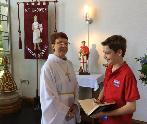 Martin talking to Churchwarden Anne Morgan about Fr. Mike's retirement.