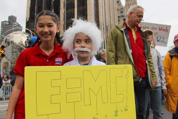 George Hanes, 8, dressed as Albert Einstein for the march.