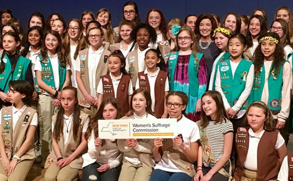 Girl Scouts in New York celebrate the creation of a badge honoring women’s suffrage.