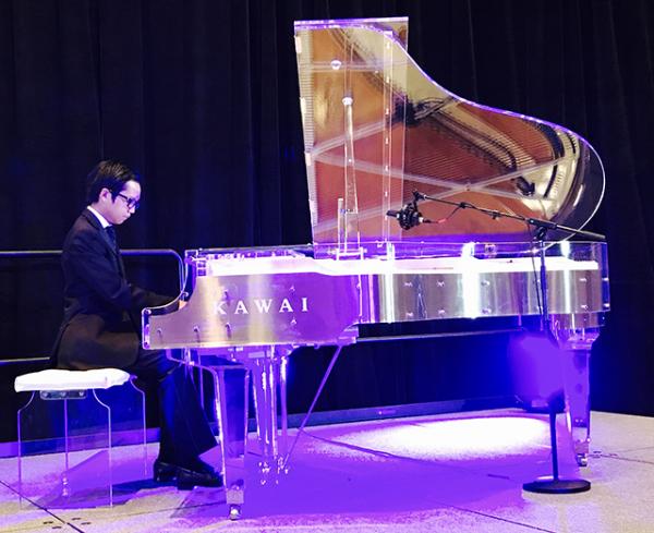 Ethan performing on a Kawai CR 40 “crystal” piano 