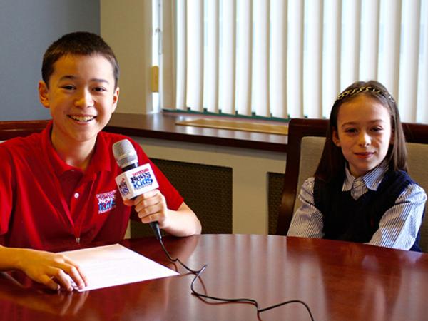 Maxwell interviews young reporter Shayna Rose in Boston. 