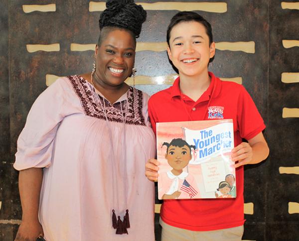 Author and illustrator Vanessa  Brantley-Newton with Max at the Society for Children's Book Authors and Illustrators Conference in Los Angeles