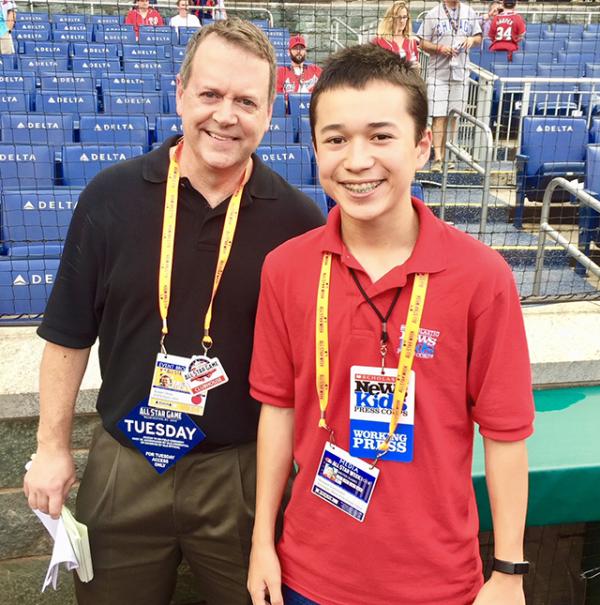 Max and Buster Olney on the field before the All-Star Game