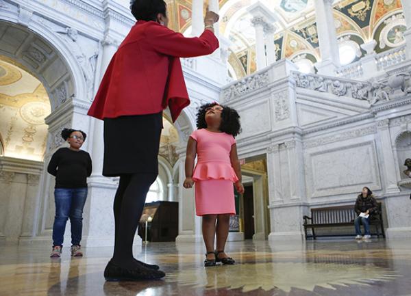 Librarian of Congress Carla Hayden shows Daliyah around the world’s largest library. 