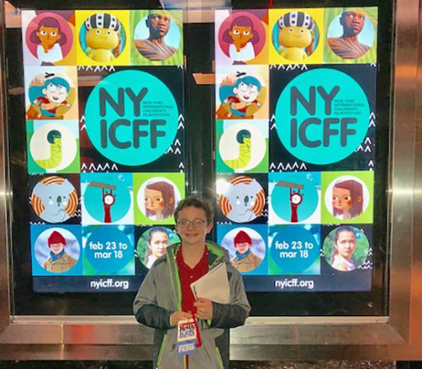 Josh in front of the NYICFF poster