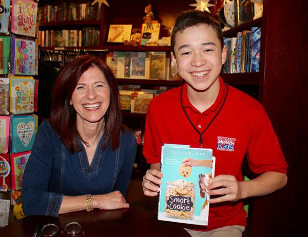 Max with children's author Elly Swartz at her book launch for Smart Cookie at Blue Bunny Books in Dedham, Massachusetts