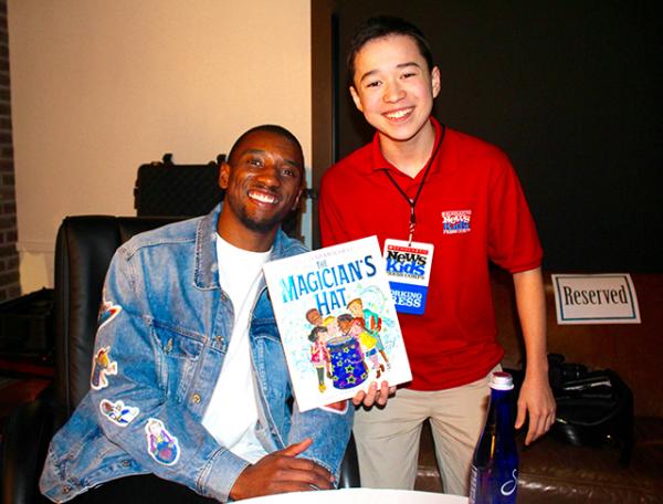 Maxwell with author and football star Malcolm Mitchell at An Unlikely Story Bookstore in Plainville, Massachusetts