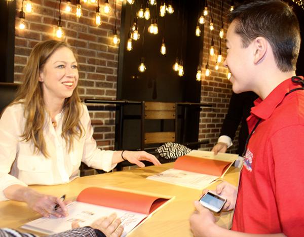 Max gets his book signed by children's author Chelsea Clinton at An Unlikely Story in Plainville, Massachusetts