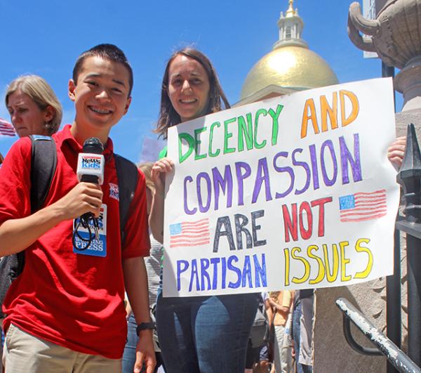 Max with a protester at the Massachusetts State House in Boston Max with a protester at the Massachusetts State House in Boston