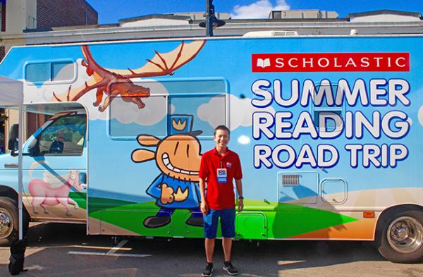Max reporting at the Scholastic Summer Reading Road Tour at the Blue Bunny Bookstore in Dedham, MA