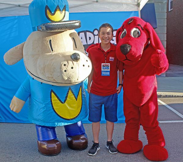Max and literary characters Dog Man and Clifford at the Scholastic Summer Reading Road Tour in Dedham, MA
