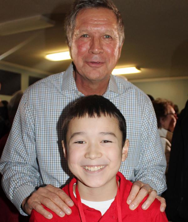 Ohio Governor John Kasich with Maxwell Surprenant at a “town hall” event in Goffstown, New Hampshire.