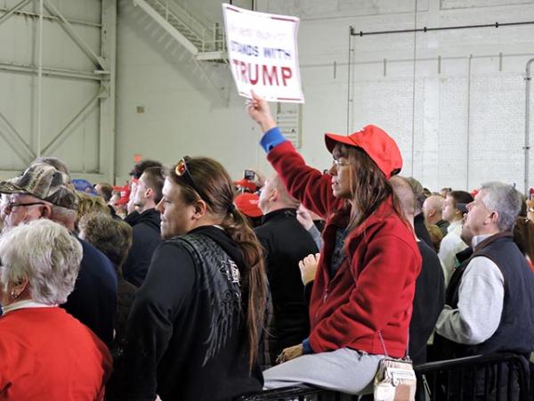 Trump supporters listen to the presidential candidate speak at a Super Tuesday rally in Columbus, Ohio. 
