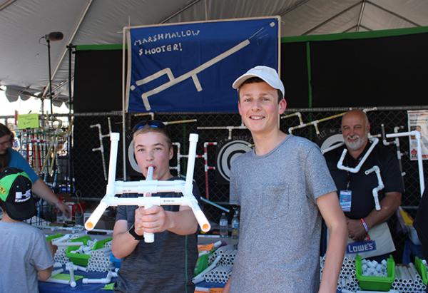 Erin B. and Sam P. making marshmallow shooters at Maker Faire. 