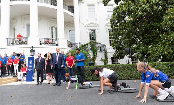 President Donald J. Trump announces the start of a race on South Lawn drive, during the White House Sports and Fitness Day event, Wednesday, May 30, 2018, at the White House in Washington, D.C.