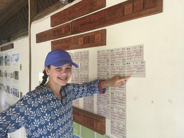 Lilian with information card for each turtles nest