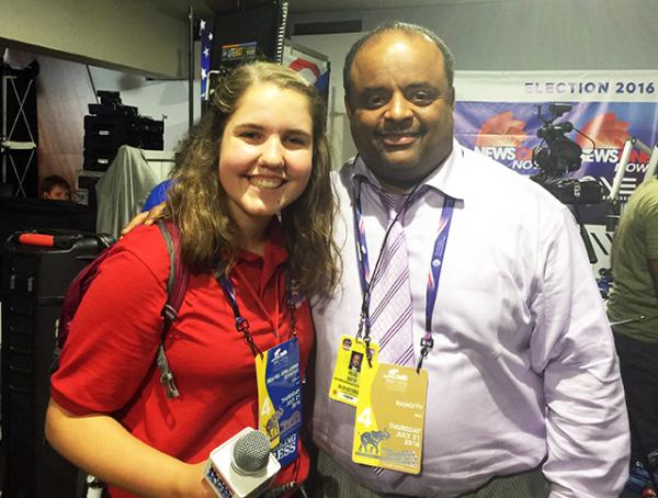 Kyra with political commentator and social justice activist Roland Martin 