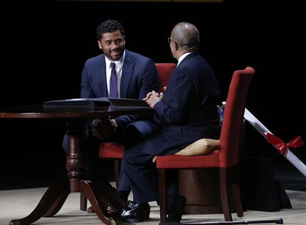 Wilson smiles as he and Gates discuss his family history.