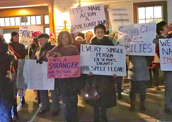 Local residents express support for making Acton, Massachusetts, a sanctuary city after President Trump instituted a temporary ban on people entering the United States from several predominately Muslim countries. Local residents express support for making Acton, Massachusetts, a sanctuary city after President Trump instituted a temporary ban on people entering the United States from several predominately Muslim countries.