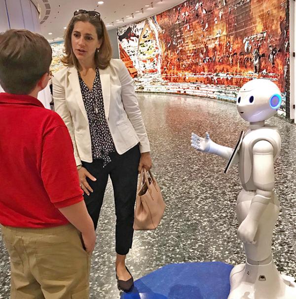 Nolan talks with Rachel Goslins at the Hirshhorn Museum and Sculpture Garden as “Pepper” looks on.