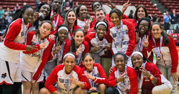 Hoop star Maria Alvarez (front row, second from left) celebrates with her Miami Country Day teammates after winning the DICK’s Sporting Goods High School Nationals on April 4 at Madison Square Garden.