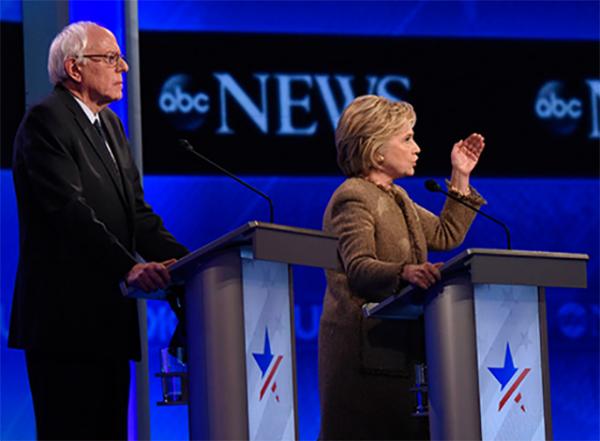 Vermont Senator Bernie Sanders, and former Secretary of State Hillary Clinton debate the issues on December 19 in Manchester, New Hampshire. Vermont Senator Bernie Sanders, and former Secretary of State Hillary Clinton debate the issues on December 19 in Manchester, New Hampshire.