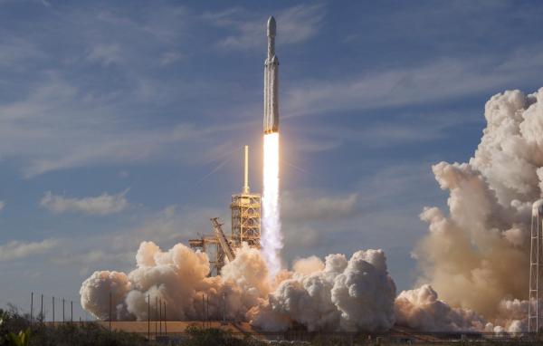 The Falcon Heavy, based on the Falcon 9 vehicle, launches from the Kennedy Space Center on Feb. 6, 2018