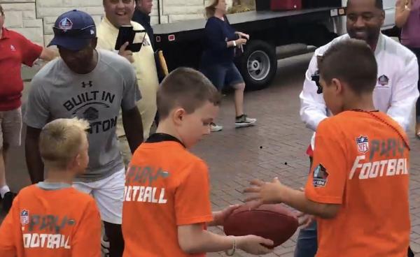 Kids deliver ball to Pro Football Hall of Fame during First Play