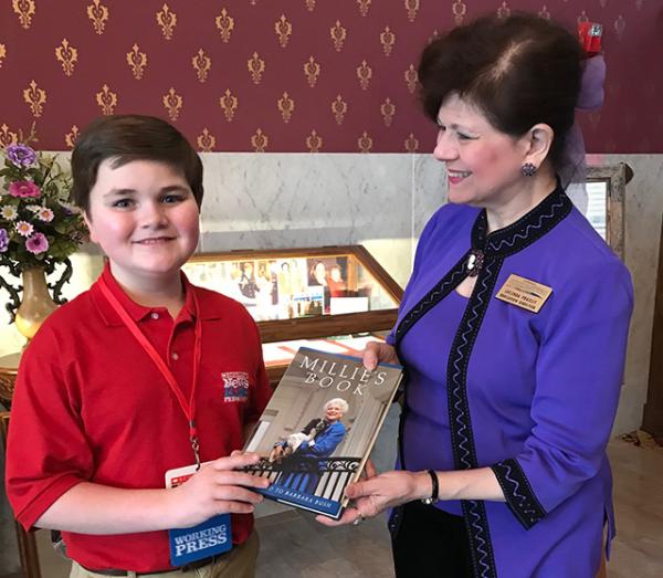 Nolan with one of the books authored by Barbara Bush and Lucinda Frailly, Director of Education, National First Ladies’ Library Canton, Ohio.