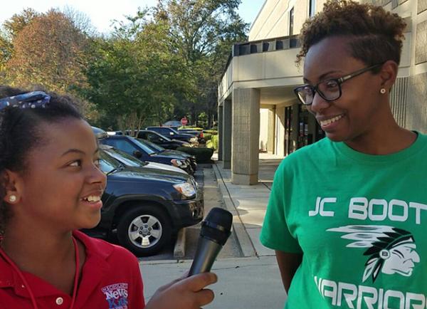 Genesis talks with voter Dreeka Owens in Peachtree City, Georgia.