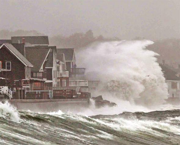 Waves crash over a seawall in Scituate, Massachusetts, on the eve of Hurricane Sandy in October 2012. The superstorm claimed more than 230 lives in the United States and caused an estimated $65 billion in damages.