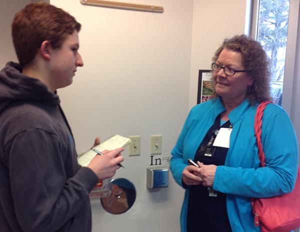 Connor speaks to voters as they exit the polls on Wisconsin primary day.