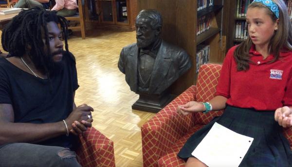 ￼ Lilian talks with author Jason Reynolds at her school in Milwaukee, Wisconsin.