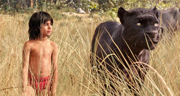 Mowgli, played by Neel Sethi, and Bagheera (voiced by Ben Kingsley) set off on an adventure in The Jungle Book, a new live-action movie from Disney.