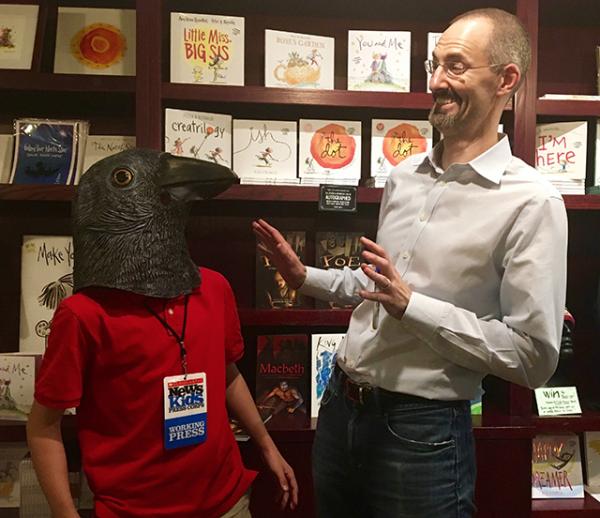 Max wears The Raven mask as Gareth Hinds looks on.