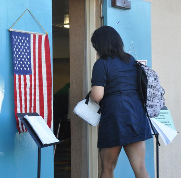 A young voter, Ipod in hand, goes to the polls in Los Angeles. A young voter, Ipod in hand, goes to the polls in Los Angeles.